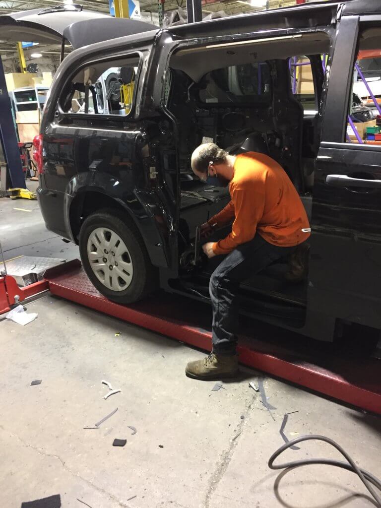 Our Driverge team installs a ramp as they modify a Dodge Caravan.