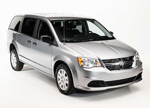 upfit-make-dodge-grand-caravan exterior of silver dodge grand caravan
