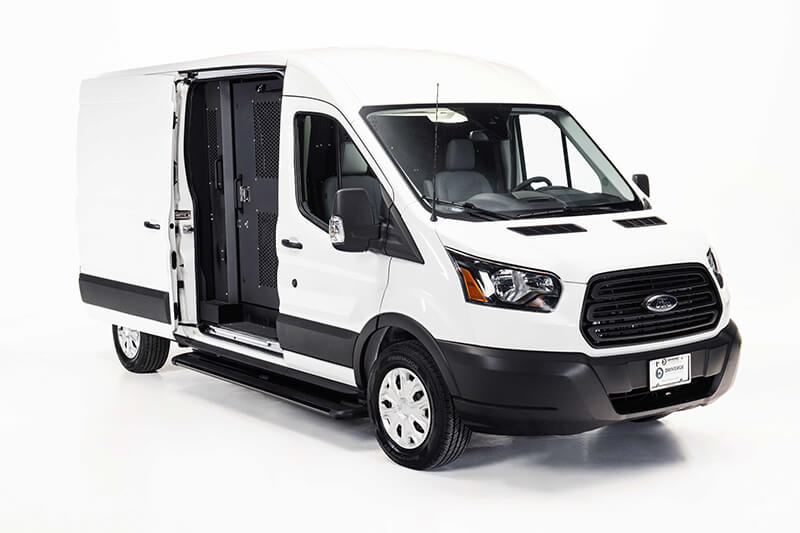 Outside view of the ford transit prision transport vehicle, side door opened to show secure door
