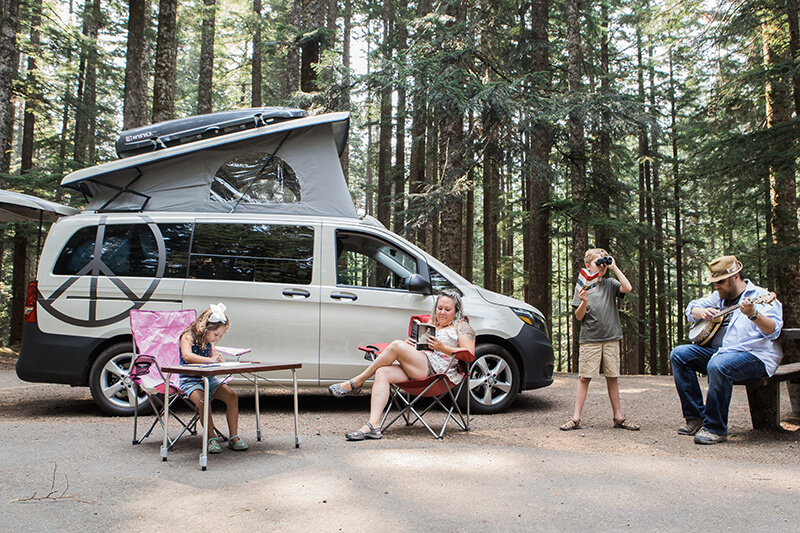 Mercedes Metris camera van with family camping