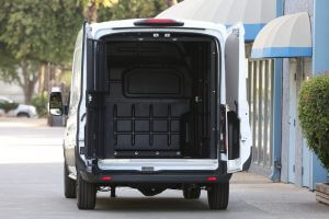 rear view of secure transport vehicle with rear cargo cage open