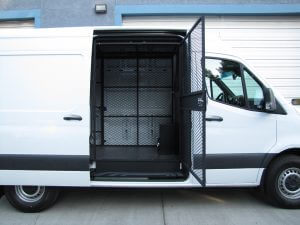 passenger side view of secre transport vehicle with side cargo cage open