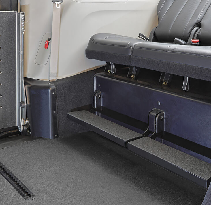 <strong>OEM third-row seating with folding footrests</strong>