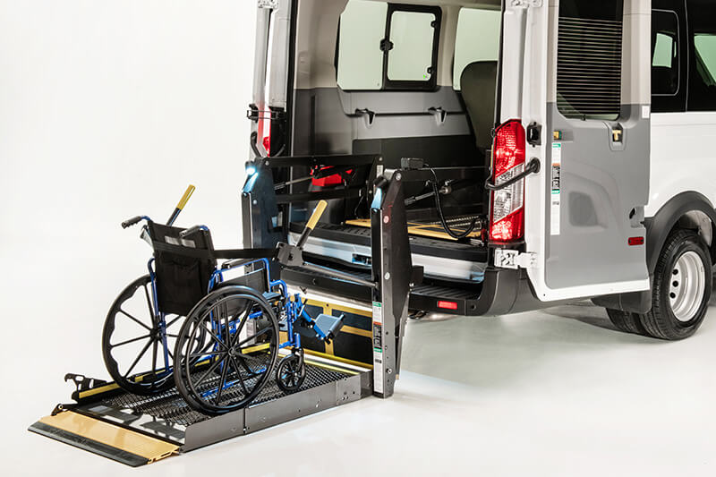 Non Emergency Transporters Non Emergency Transporter with wheelchair on ramp being loaded