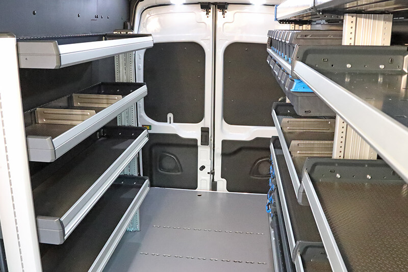 Rear of E-Transit vehicle fitted with shelves for tradesmen and contractors