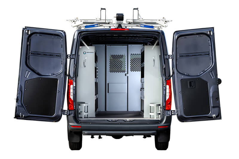 Rear view of a vocational van with open doors, revealing an interior equipped for secure transport, perfect for a skilled plumbers tools and equipment.