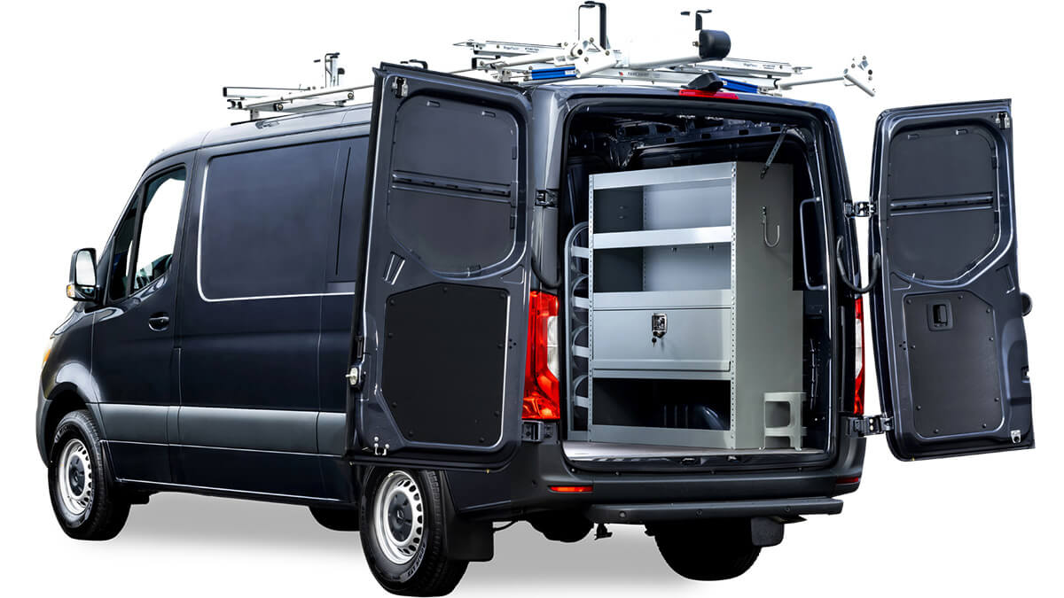 A black vocational utility van with open rear doors reveals an empty interior, perfect for HVAC professionals, featuring shelves and storage compartments. A black vocational utility van with open rear doors reveals an empty interior, perfect for HVAC professionals, featuring shelves and storage compartments.