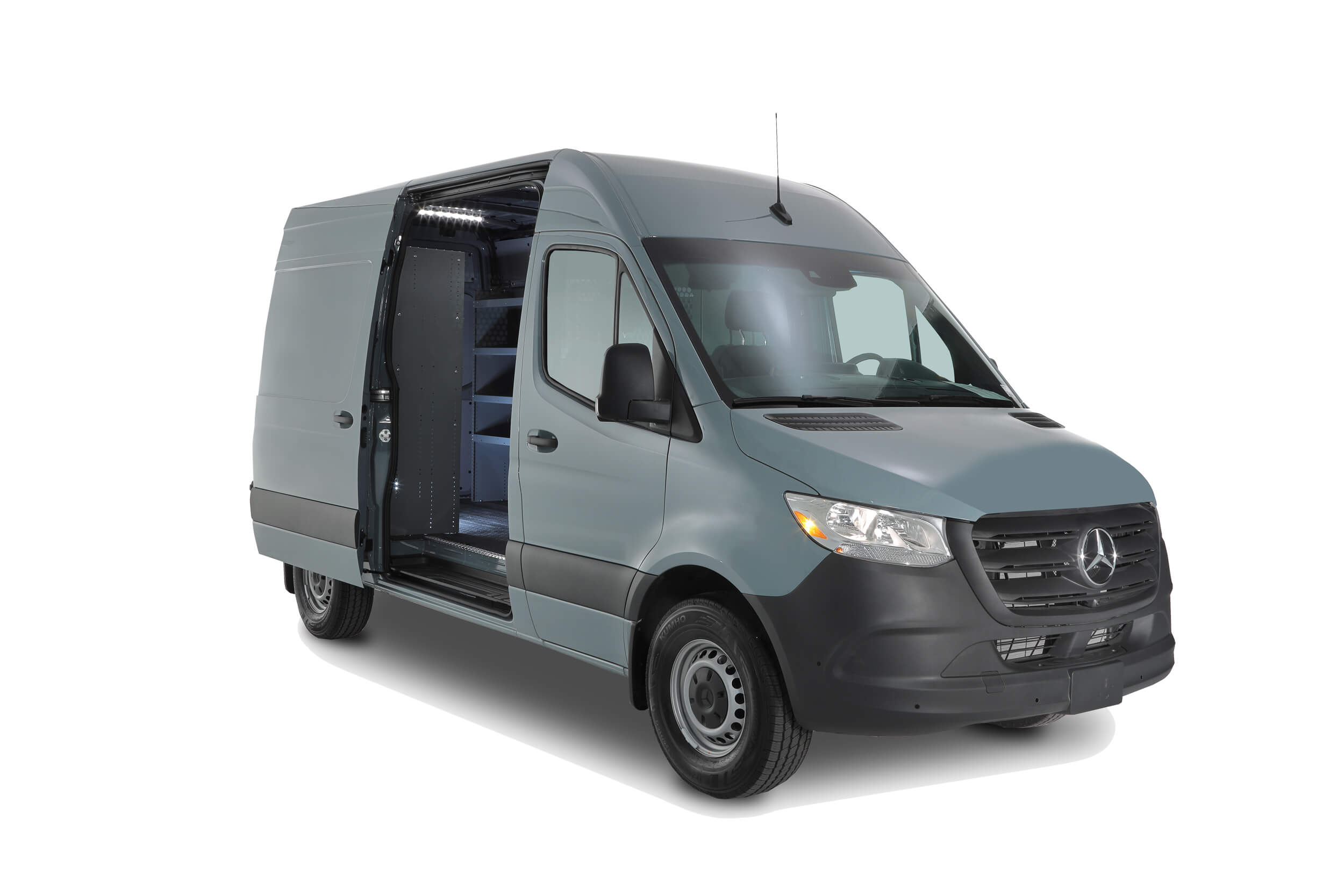 A gray cargo van with a vocational touch, featuring an open sliding side door that reveals interior shelving ideal for HVAC equipment, parked on a pristine white background. A gray cargo van with a vocational touch, featuring an open sliding side door that reveals interior shelving ideal for HVAC equipment, parked on a pristine white background.