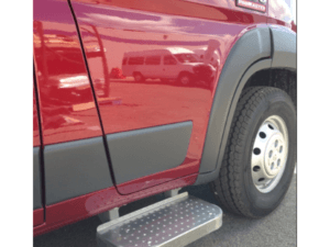 Side view of a red RAM 1500 ProMaster van showing the front passenger door, tire, and a metallic side step below the door.