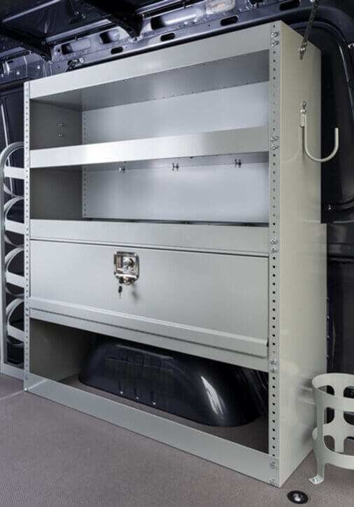 Vocational metal storage shelving unit in a van interior with various compartments and hooks, ideal for HVAC professionals. Vocational metal storage shelving unit in a van interior with various compartments and hooks, ideal for HVAC professionals.